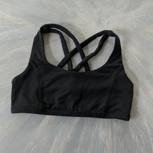 Girls black Ivivva sports bra